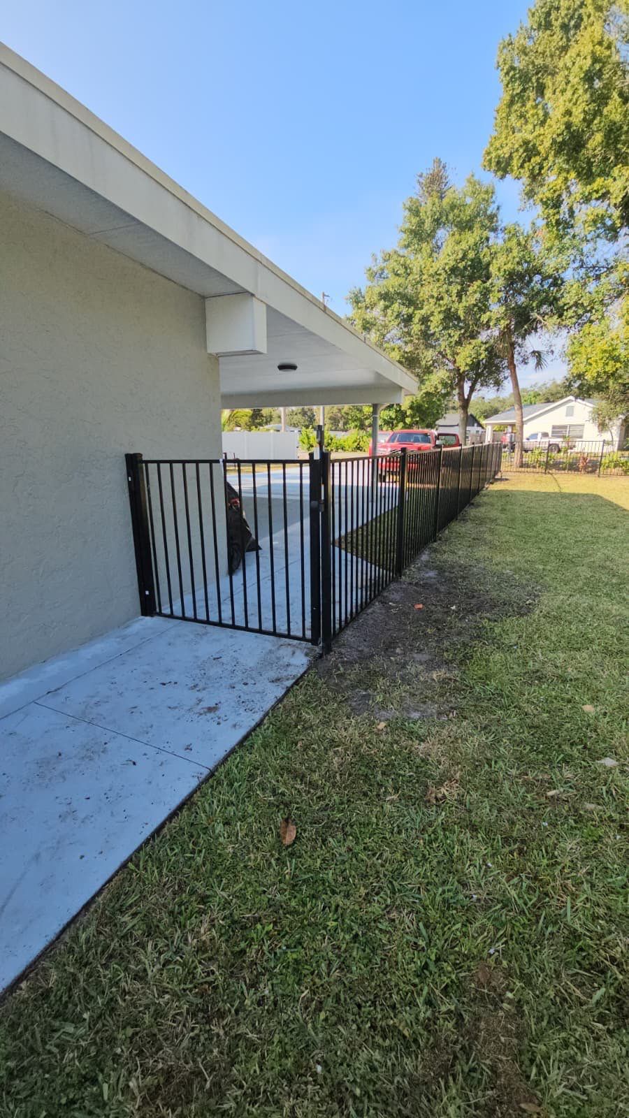 Sleek Black Aluminum Fence for Pool & Canal Views